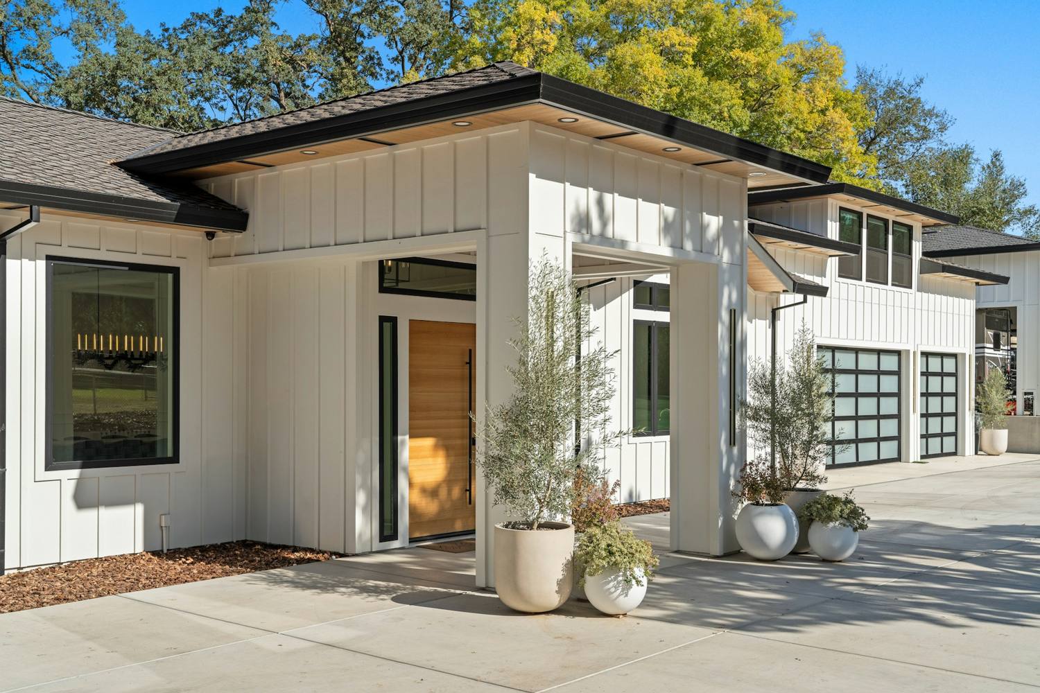 Newly finished home exterior with fiber cement siding and black windows